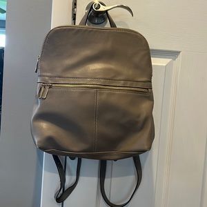 Gray mini backpack purse.